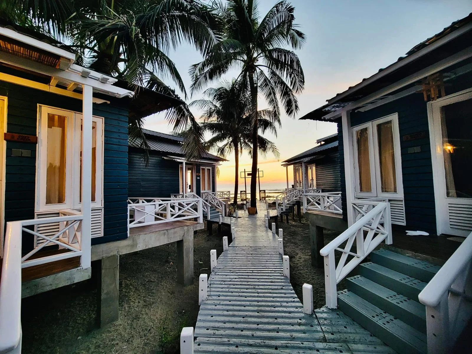 Sunset glowing between the resort villas