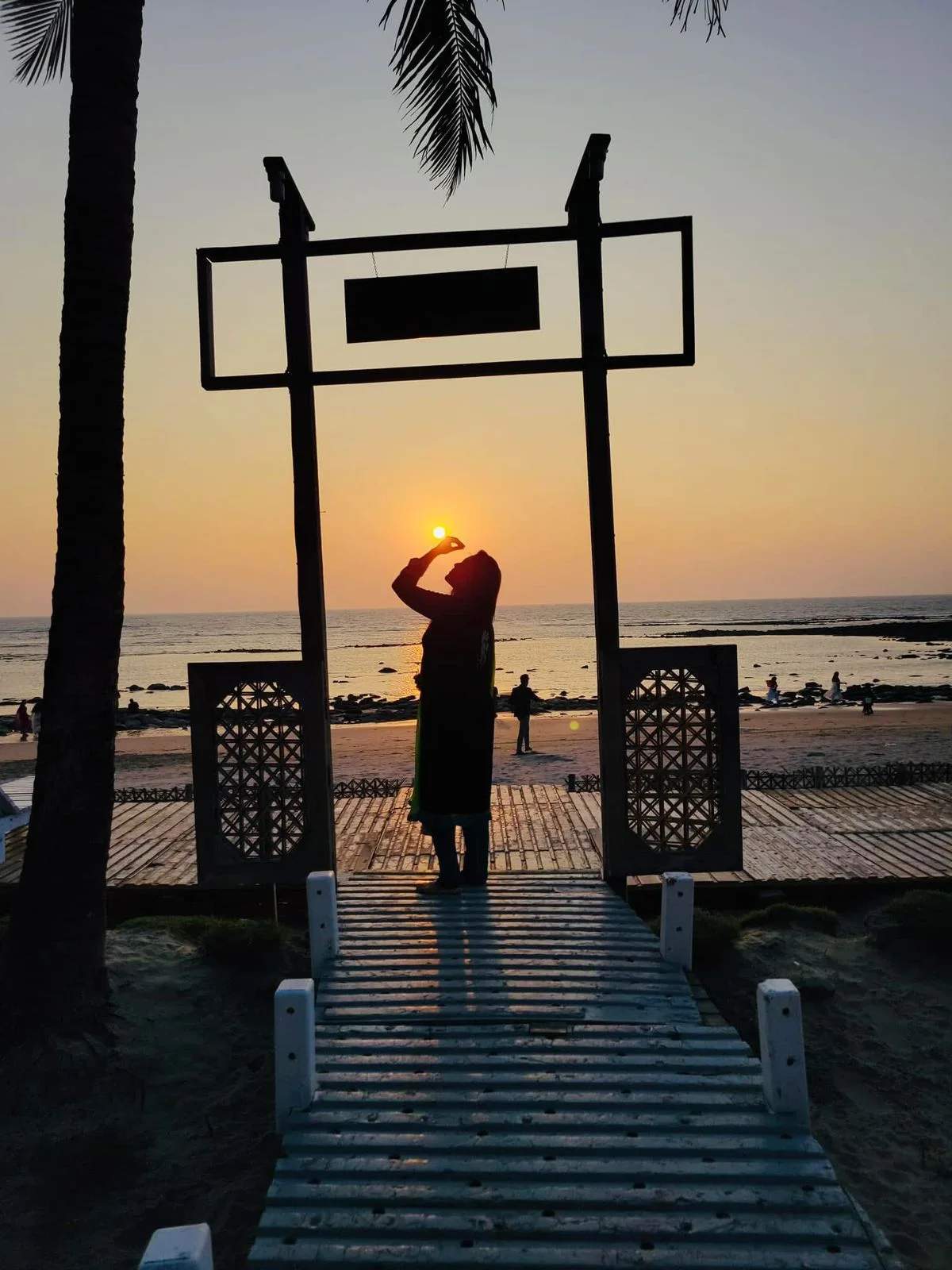 A guest enjoying sunset by the sea