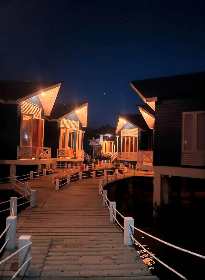 Resort villas glowing beneath the night sky