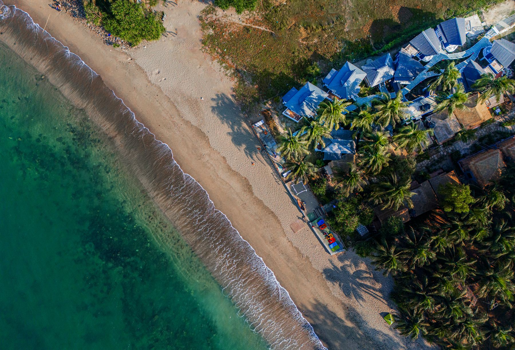 The resort and turquoise shoreline from above